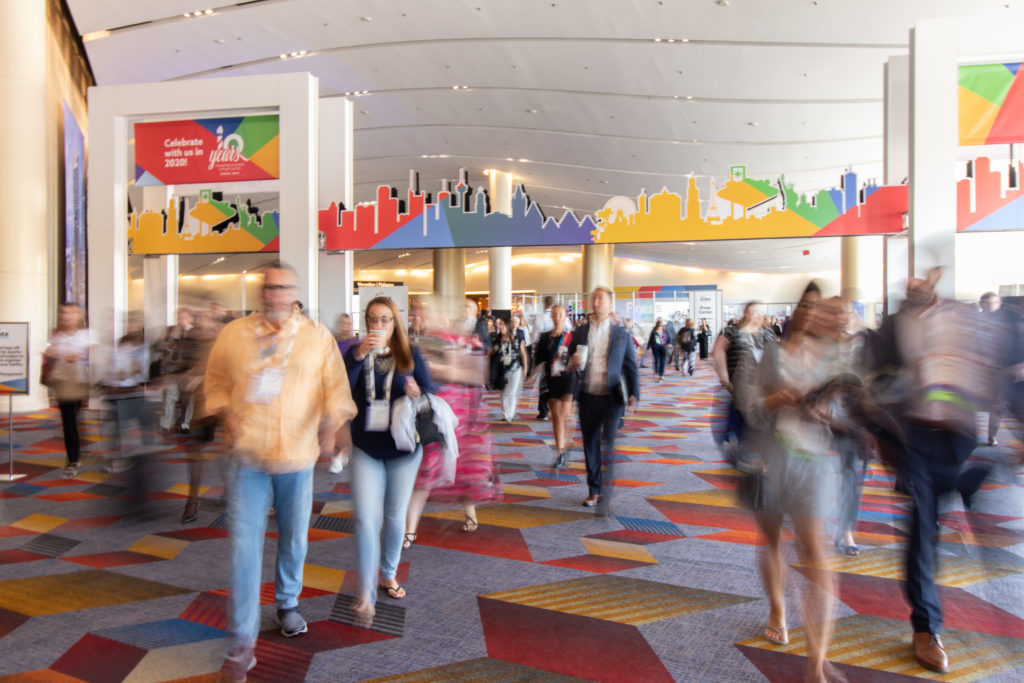 IMEX America attendees at event check-in 