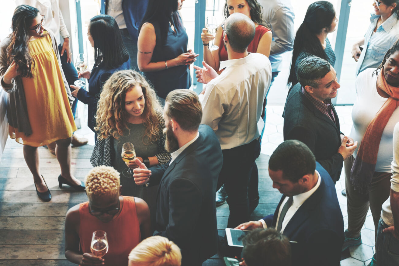 Group of business professionals mingling at event